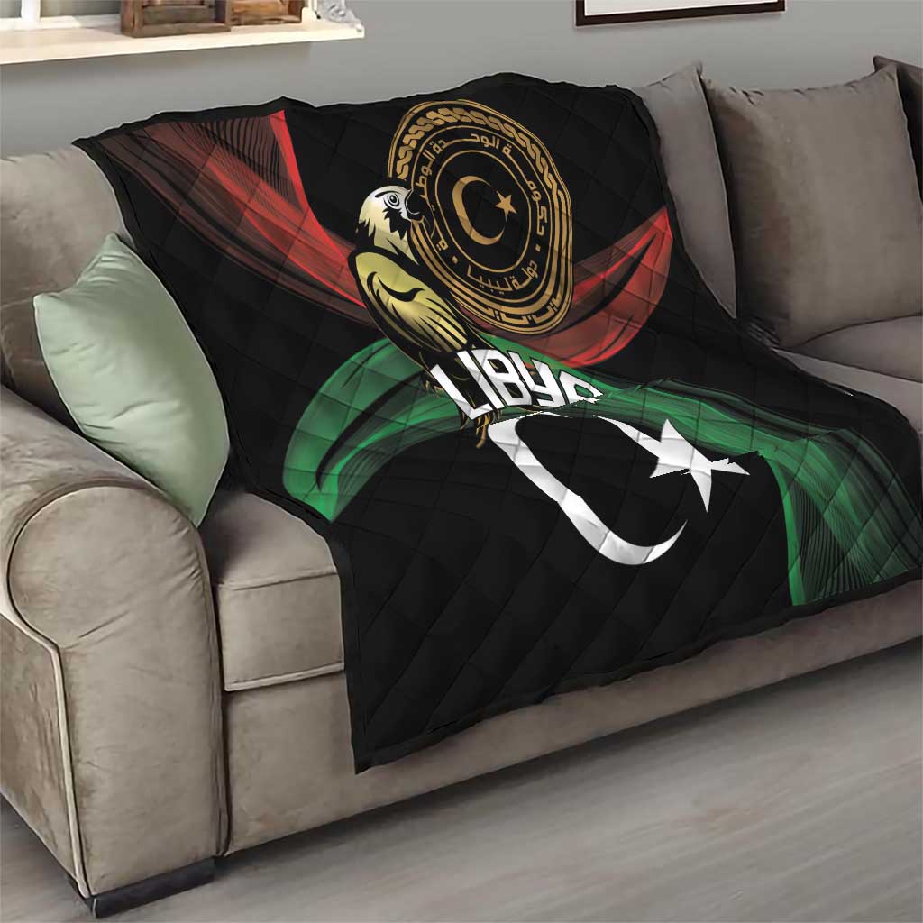 Black quilted blanket on sofa with Libya text, crescent, and star design