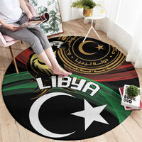 Round area rug featuring Libya text, crescent and white star, black with green-red stripes