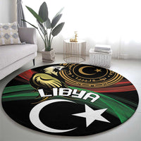 Round area rug with crescent and white star on black, gold and green decorative details