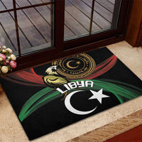 Black rubber doormat with Libya crescent and star emblem at doorway