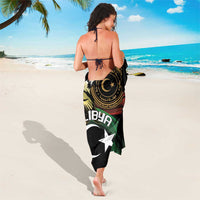 Black sarong with Libya crest and large white star, crescent, and green/red bands