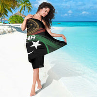 Black sarong with gold circular crest, red stripe, green band, and white star and crescent