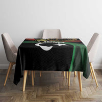 Black Libya tablecloth with white crescent and star, draped over dining table