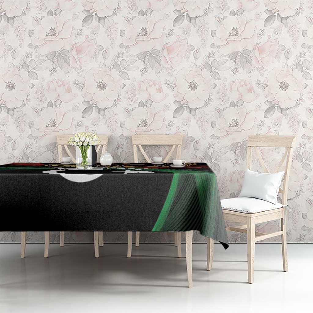 Black tablecloth with Libya crescent-and-star design, green and red details on long table