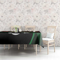 Black tablecloth with Libya crescent-and-star design, green and red details on long table