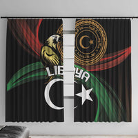 Black window curtain with gold emblem, white crescent and star, red and green accents