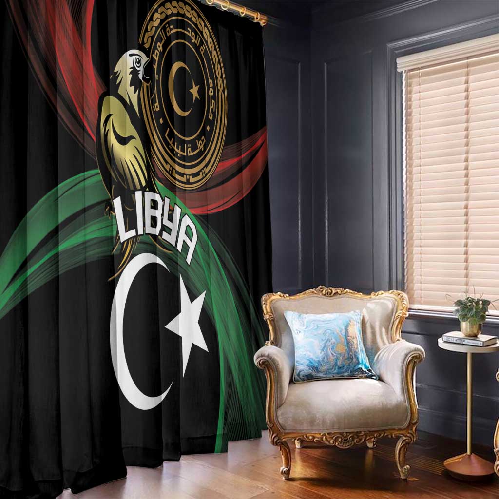 Black window curtain with gold circular emblem, white crescent and star design, red and green rays