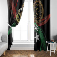 Black window curtain panel with gold emblem, white crescent and star, red and green wave design