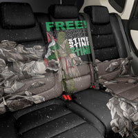 Black car seat cover with eagle graphic and camouflage print on back bench.