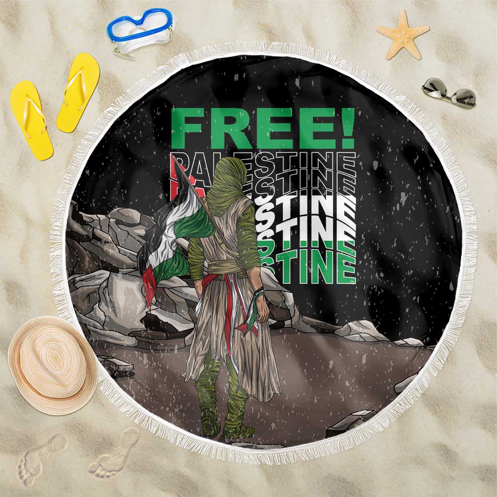 Black round beach blanket with white fringe, illustrated green text and warrior figure
