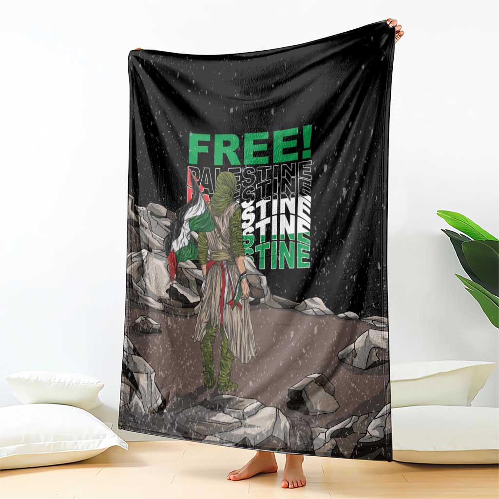 Black throw blanket with green 'FREE' and 'PALESTINE' text, displayed and spread
