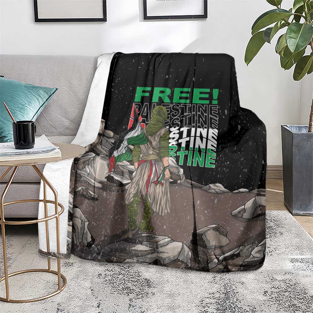Black throw blanket with green 'FREE' and protest graphic, laid on chair