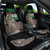 Black front car seat covers with green 'FREE!' and eagle camouflage print
