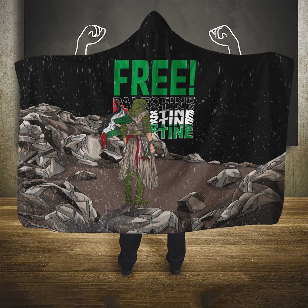 Black hooded blanket with “FREE!” text and wing-like icons on the hood