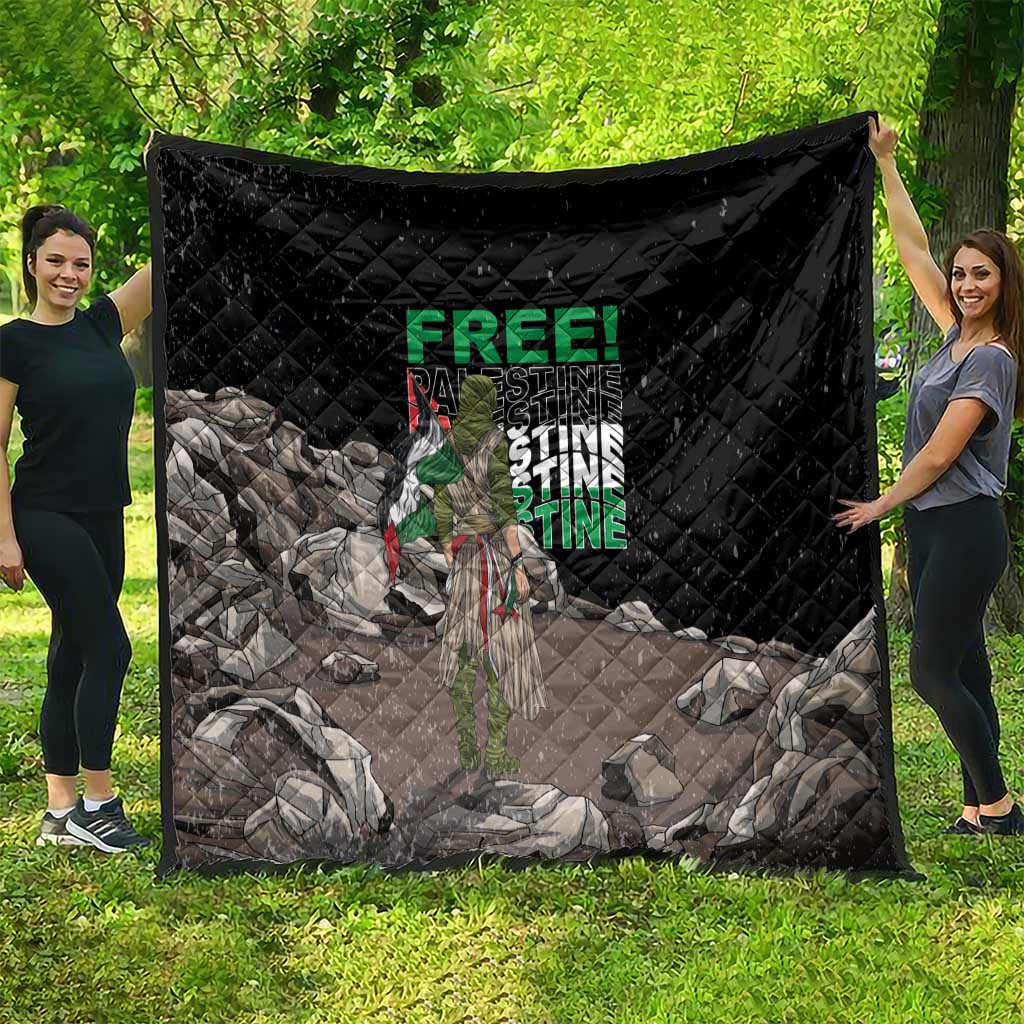 Black quilt with diamond stitching and Palestine-themed graphic, draped on a yard display