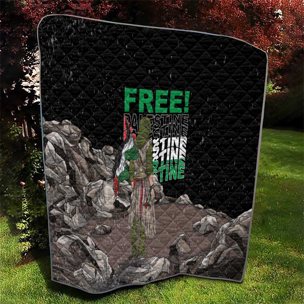 Black quilt with diamond stitching and Palestine-themed graphic, standing on a lawn