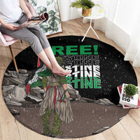 Black round carpet with green 'FREE PALESTINE' text and speckled warrior scene