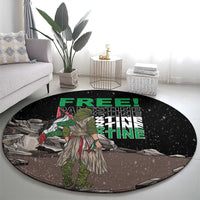 Black round carpet with central warrior illustration and green 'FREE PALESTINE' text