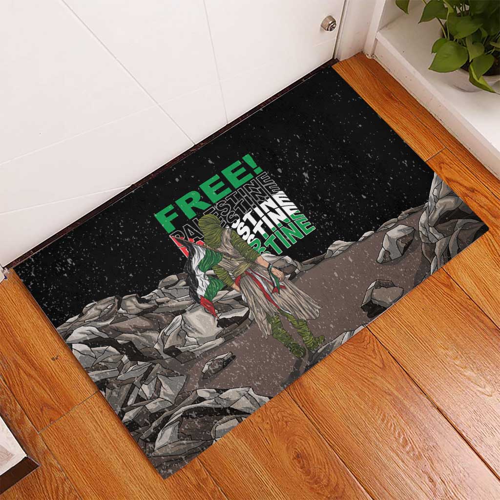 Black rubber corner mat with eagle figure, green “FREE” and “PALESTINE” lettering