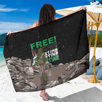 Black sarong with FREE! text and eagle graphic over gray stone scene