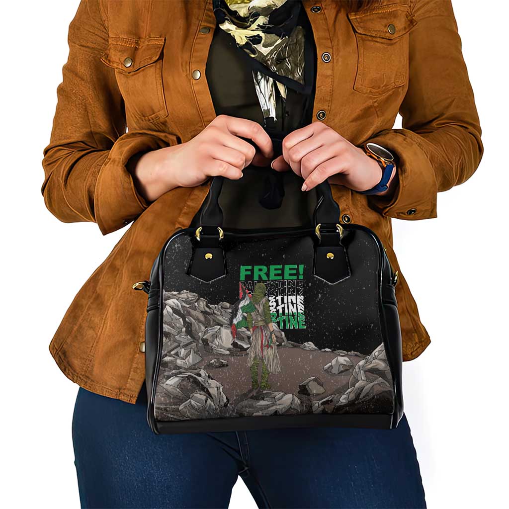 Black shoulder handbag with top handles, front graphic on textured panel
