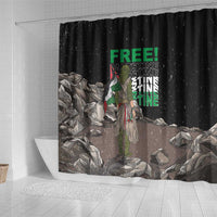 Black shower curtain with green “FREE!” text, figure with flag colors, rubble artwork