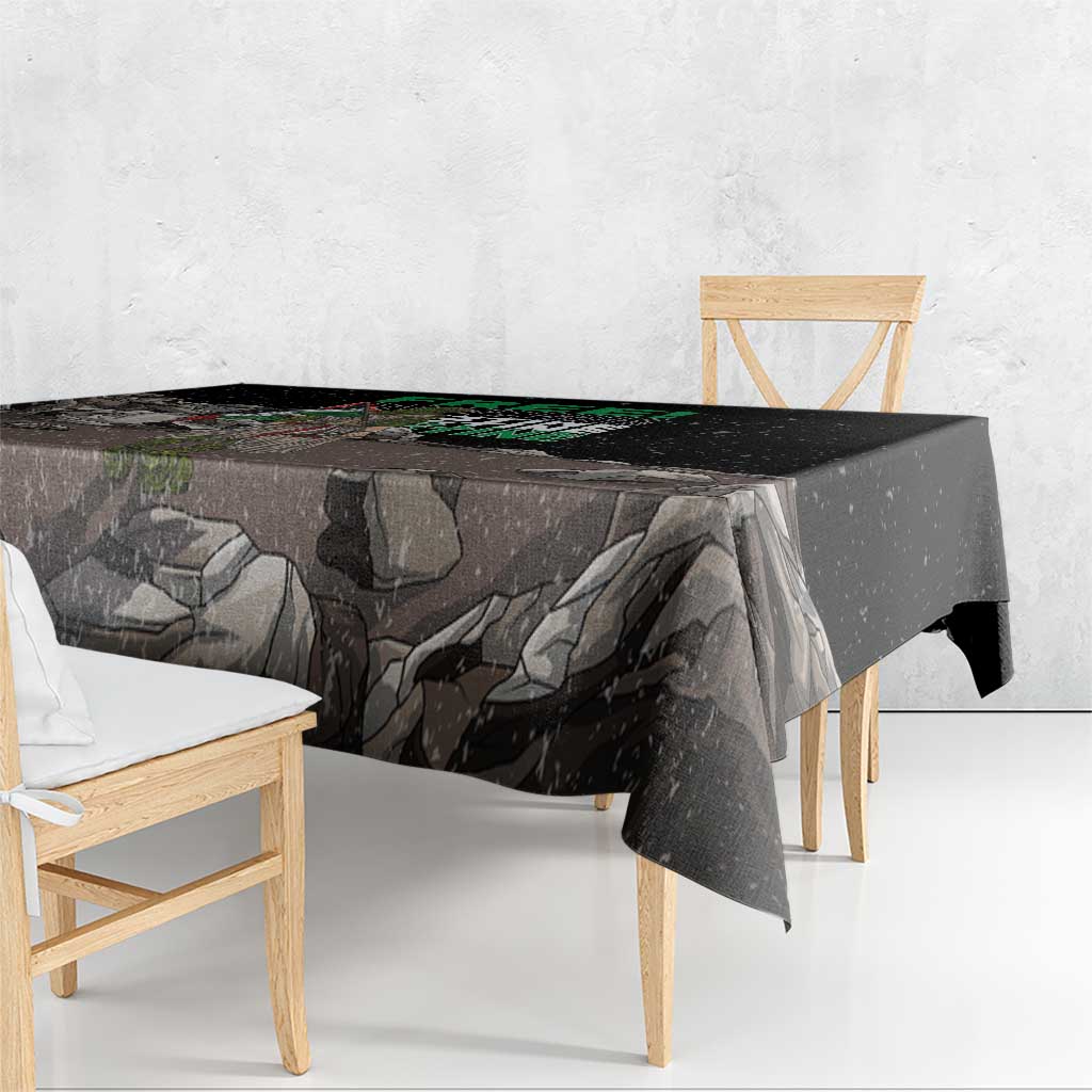Black tablecloth close-up with eagle and gray rock landscape print