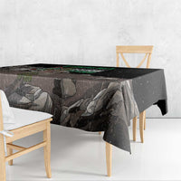 Black tablecloth close-up with eagle and gray rock landscape print