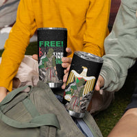Two black stainless steel tumblers with FREE! Palestine eagle graphics, held by people.