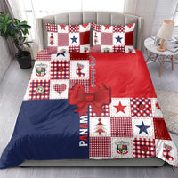 Christmas bedding set featuring red, blue, and white patchwork with star patterns and two pillows