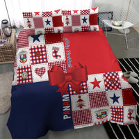 Christmas bedding set with red and navy blue fabric panels, patchwork blocks, and oversized bow