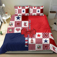 Christmas bedding set with patchwork squares in red, blue, and white, matching pillows and bow