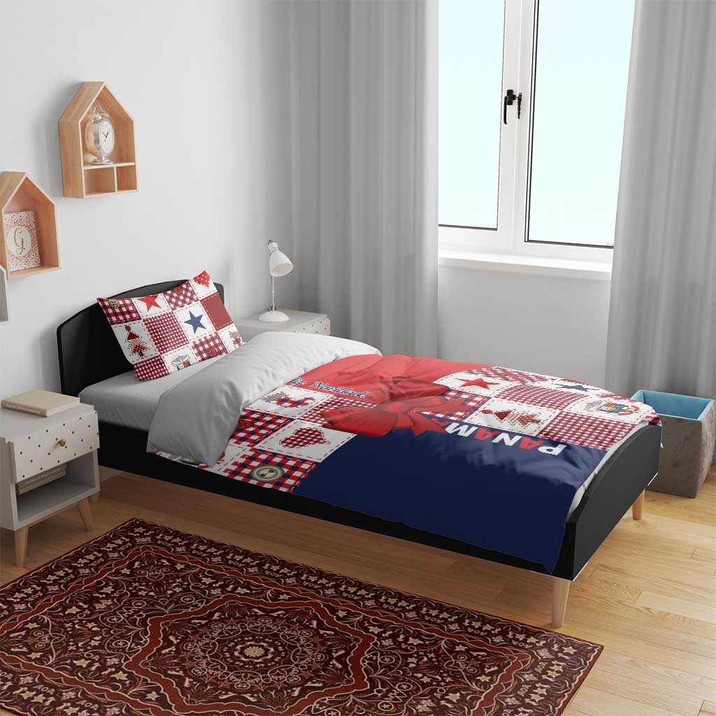 Christmas bedding set on bed with white, red, and navy patchwork design, bow detail