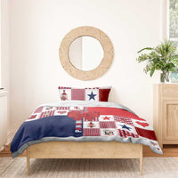 Christmas bedding set with red, navy, and white patchwork featuring stars and large ribbon bow