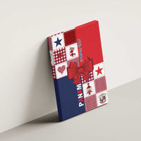 Red Panama Feliz Navidad canvas wall art with plaid blocks, star details, and red bow on side view