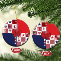 Ceramic Christmas ornament with red and navy patchwork design, bow, and gold hanging cord