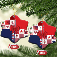 Two red and navy ceramic ornament shapes with patchwork pattern, red bow, and gold cord