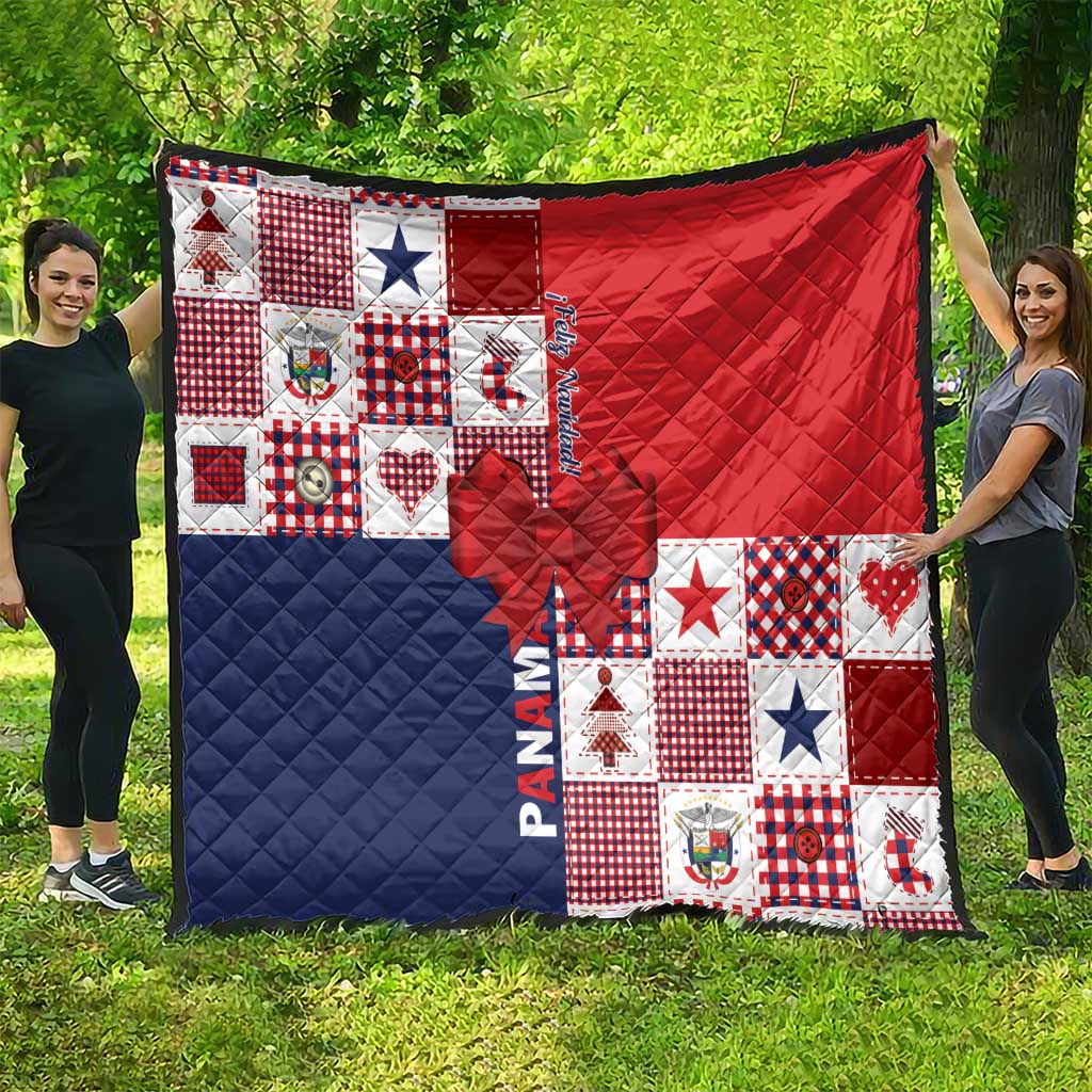 Patchwork Christmas quilt with red quilted panel, navy panel, and bow applique