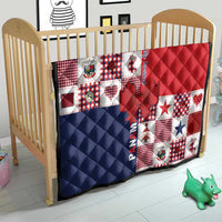 Christmas quilt for crib with red, navy and white patchwork blocks and bow applique
