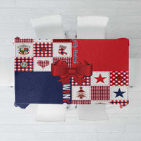 Red and navy patchwork tablecloth with large red bow and festive blocks