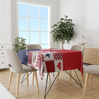 Festive patchwork tablecloth in red, white, and navy with corner drape