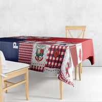 Red and navy patchwork tablecloth draped over dining bench and chairs