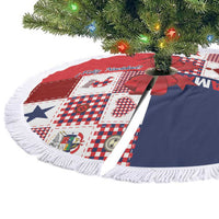Red and navy Christmas tree skirt with 'Feliz Navidad' print and white fringe edge