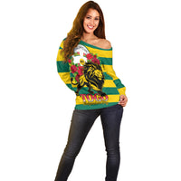 Women’s off-shoulder striped sweater with lion and rose graphic, yellow and green, long sleeves