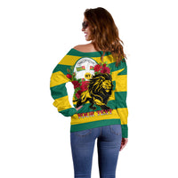 Women’s off-shoulder striped sweater, side back view with lion and rose design, yellow-green sleeves