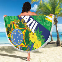 Round Brazil beach blanket with star crest and yellow floral artwork, white fringed border