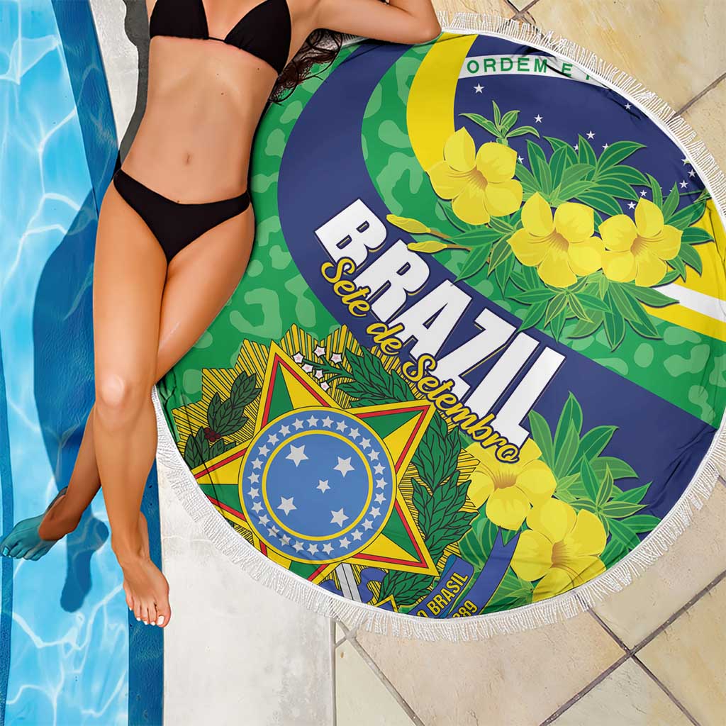 Round Brazil beach blanket with Brazil crest, green leaves, and yellow flower print, fringed edge