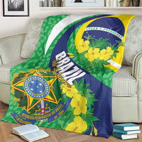 Brazil-themed throw blanket with green, blue, yellow floral print and central shield emblem