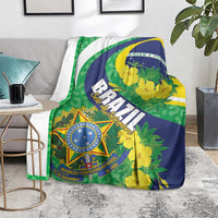 Brazil-themed blanket laid on floor with green blue yellow floral pattern and shield emblem