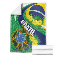 Brazil-themed throw blanket with green, blue, and yellow floral pattern and shield emblem
